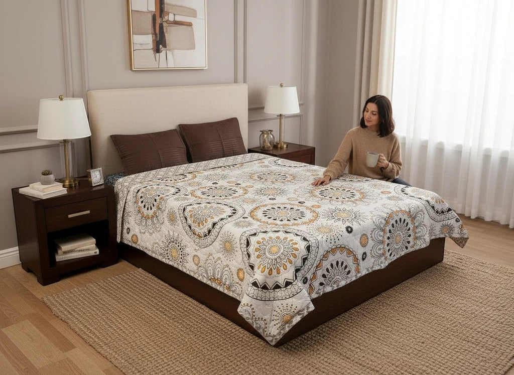 AthSVi Alayam king size cotton comforter with black and golden amber mandala block print on a white base.