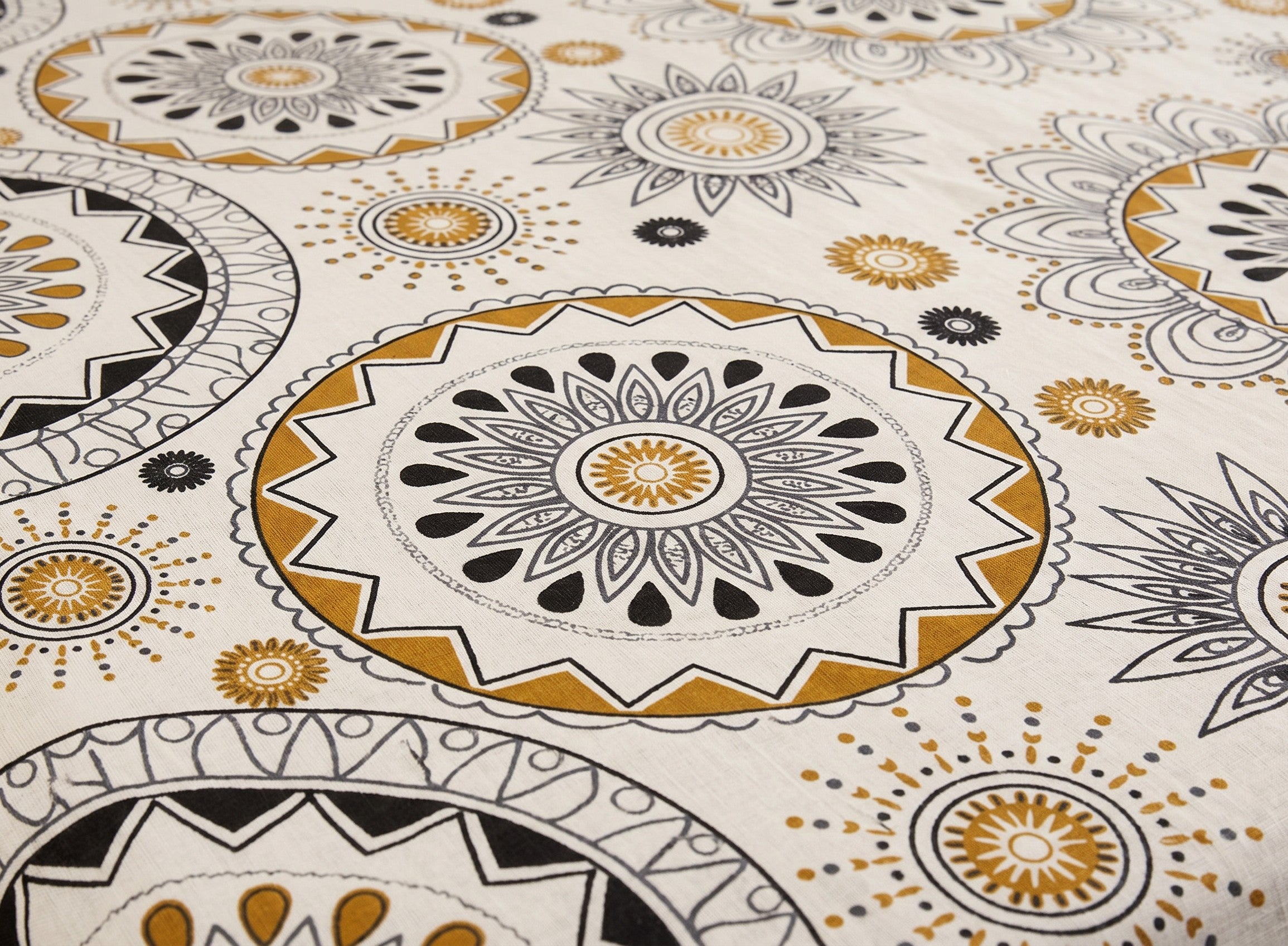 AthSVi Alayam king size cotton comforter featuring a black and golden amber mandala block print on a white base